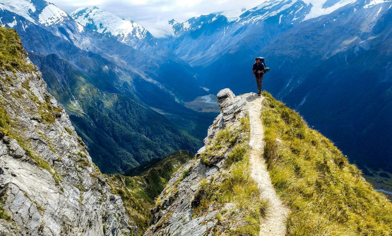 A person standing on top of a mountain